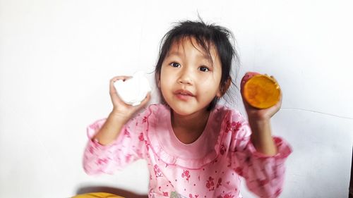 Portrait of cute girl holding ice cream