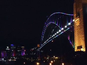 Low angle view of firework display against sky at night