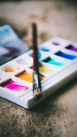 Close-up of multi colored pencils on table