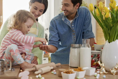 Family preparing food in kitchen