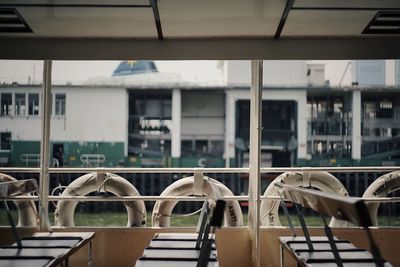 Empty chairs and tables in row