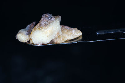 Close-up of ice cream over black background