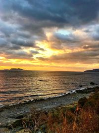 Scenic view of sea against sky during sunset