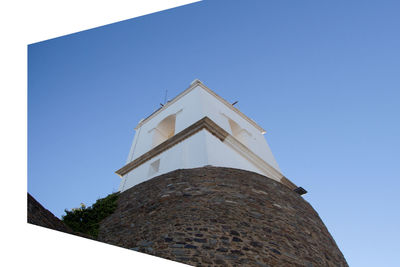 Low angle view of bell tower against clear sky