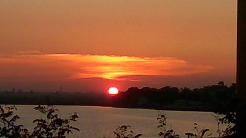 Scenic view of silhouette landscape against romantic sky at sunset