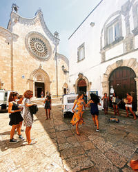 Group of people in front of building