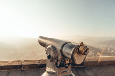 Close-up of coin-operated binoculars against clear sky