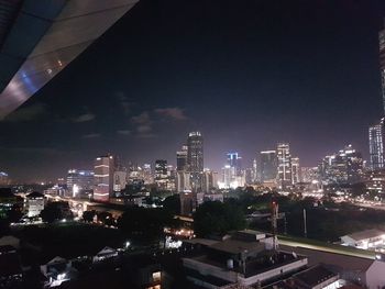 Aerial view of city lit up at night