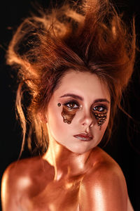 Close-up of young woman fine art makeup 