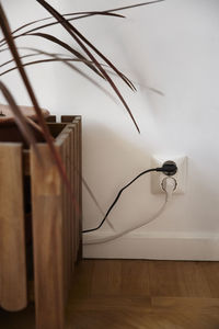 Plugs in wall outlet