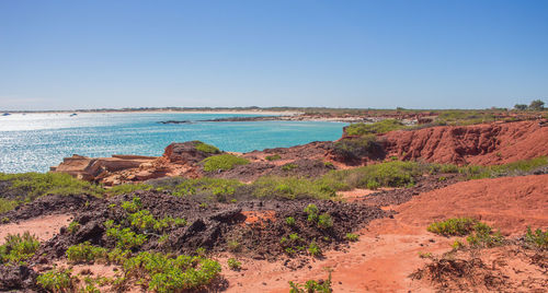 Scenic view of sea against clear blue sky