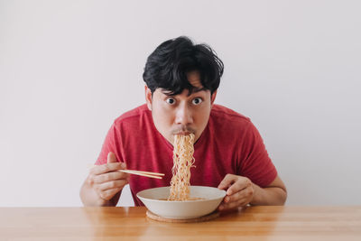 Portrait of man eating food