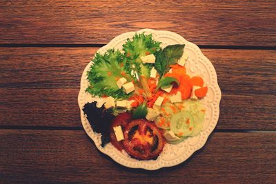 Directly above shot of vegetables in plate on table