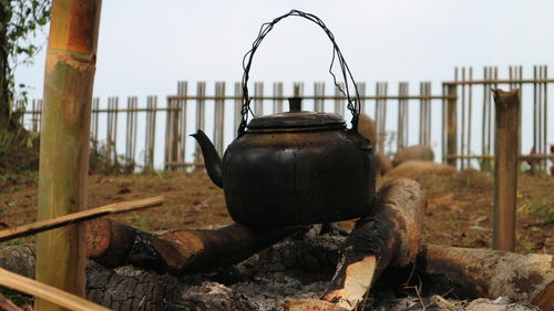 Tea kettle over bonfire