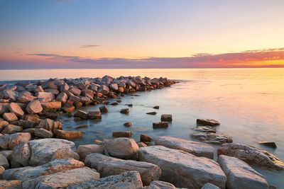 Scenic view of sea against sky during sunset