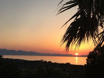 Scenic view of sea against romantic sky at sunset