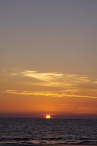 Scenic view of sea at sunset