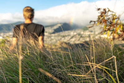 Close-up of grass against man