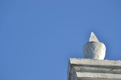 Low angle view of built structure against clear blue sky