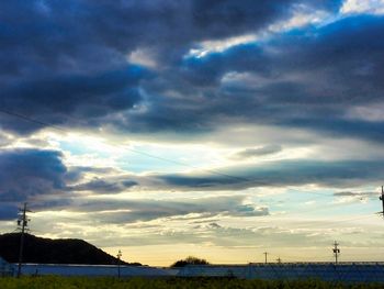 Scenic view of landscape against cloudy sky