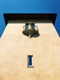 Low angle view of building against blue sky