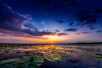 Scenic view of sea against dramatic sky