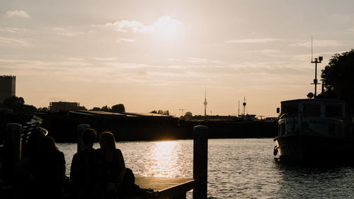 Scenic view of river against sky during sunset