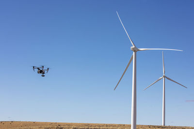 Wind turbines on field with camera drone
