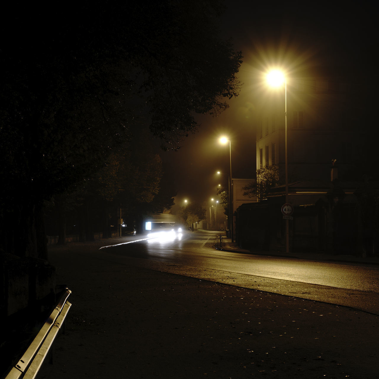 ILLUMINATED STREET LIGHTS AT NIGHT