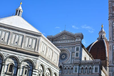 Low angle view of building against blue sky