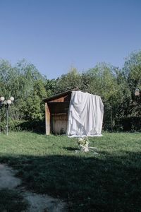 Trees on field against clear sky