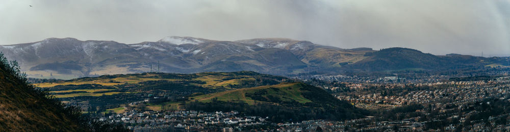 Panoramic view of townscape against mountains