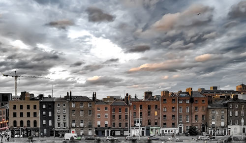 Buildings in city against sky