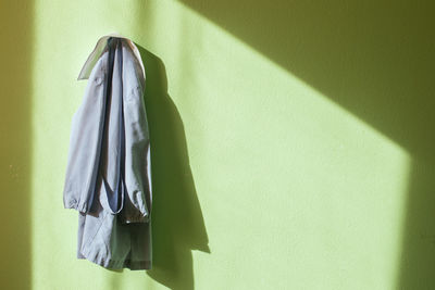 Close-up of clothes hanging on wall