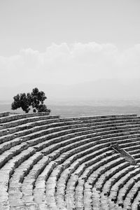 Ancient amphitheatre against sky