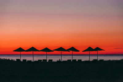 Scenic view of beach against sky during sunset