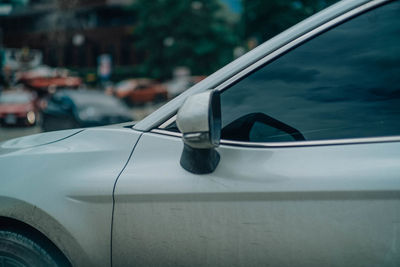 Close-up of car on side-view mirror