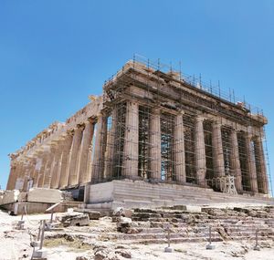 Low angle view of temple against clear blue sky