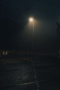 Empty road in city at night