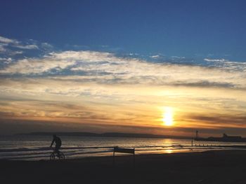 Scenic view of sea at sunset