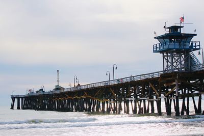 Pier over sea against sky