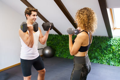 Young woman exercising in gym