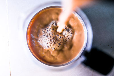 High angle view of coffee in cup on table