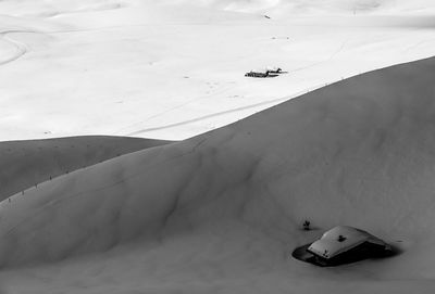 High angle view of cars on snow covered land