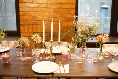 Flower vase on table in restaurant