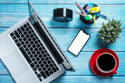 High angle view of coffee cup on table