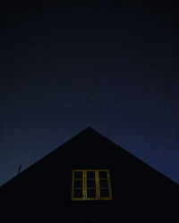 Low angle view of building against sky at night