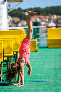 Girl doing stunt in boat
