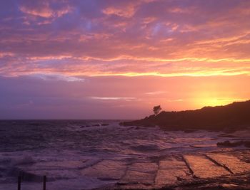 Scenic view of sea against sky during sunset