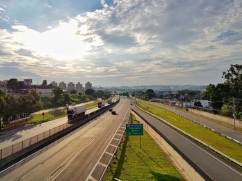 High angle view of road by city against sky